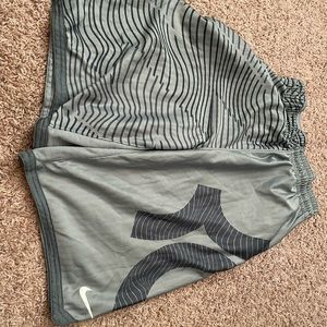 Grey Nike basketball shorts.
